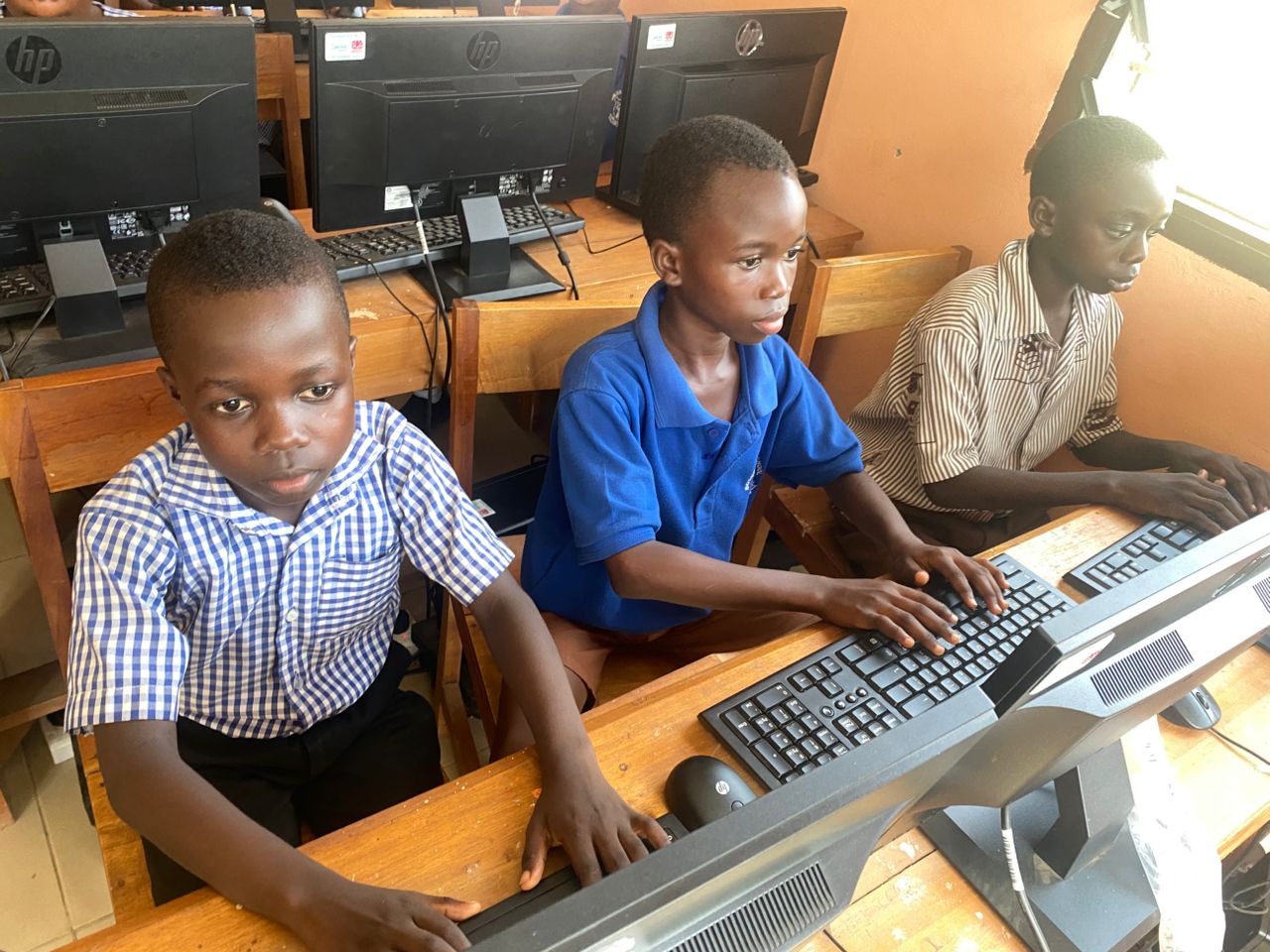 Volunteers teaching coding