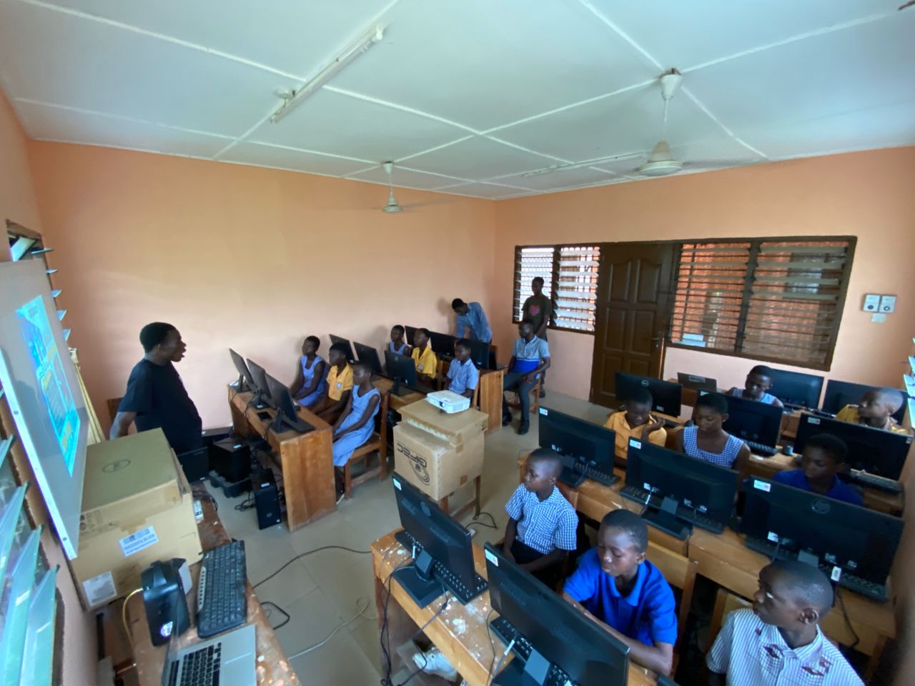 Smiling students with tech